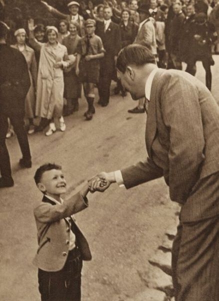 A-small-boy-shaking-the-hand-of-the-great-leader-Adolf-Hitler
