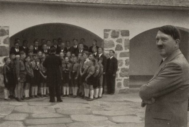 Adolf-Hitler-is-delighted-by-the-singing-of-the-beautiful-German-children